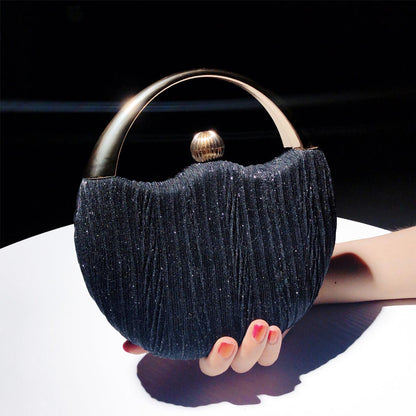 Elegant Handbag with Luxury Round Handle and Spacious Interior